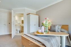 commercial photography nottingham residential care home bedroom with table over bed wardrobe and wet room