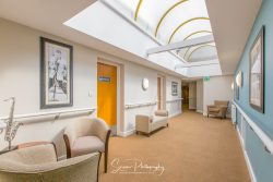commercial photography nottingham care home corridor with pictures on the wall roof light seating areas